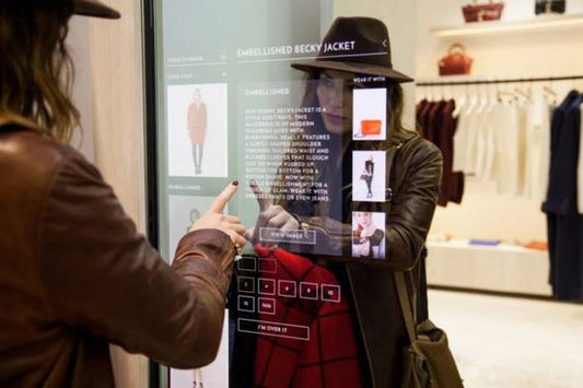 woman choosing dress options from an interactive mirror