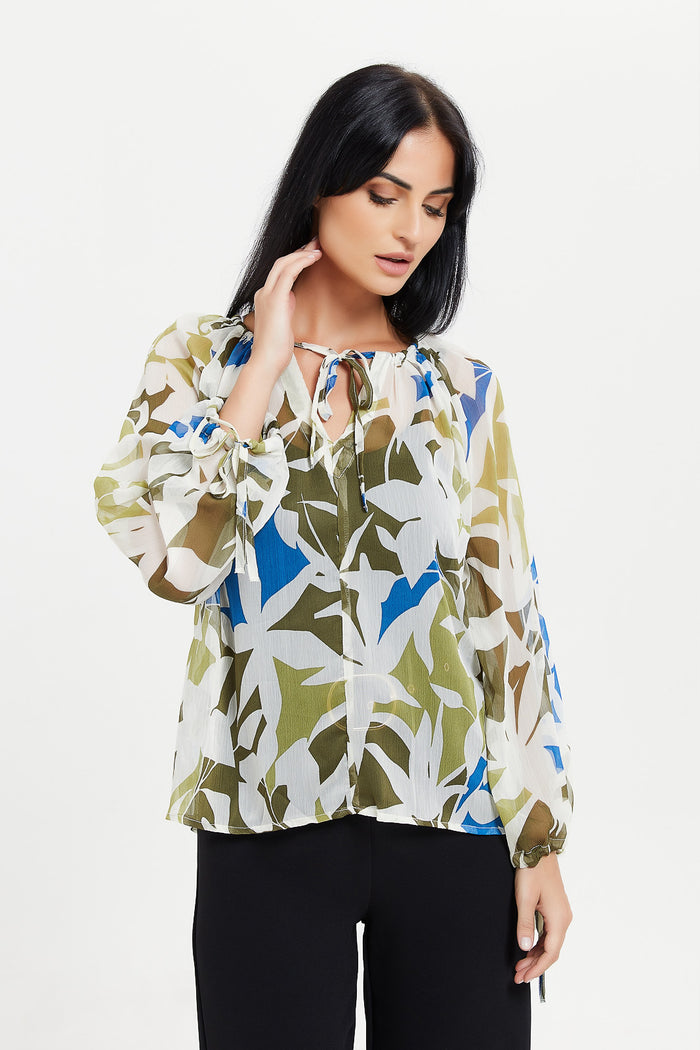 woman wearing a chiffon blouse printed