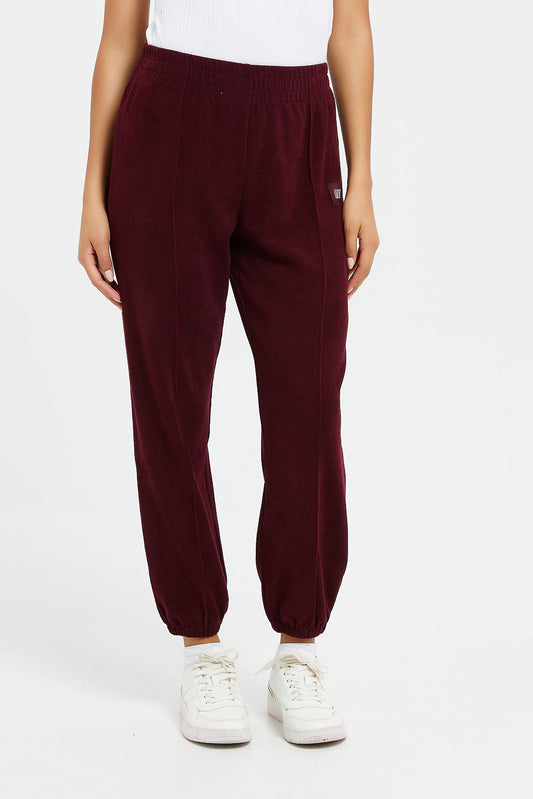 Redtag-Burgundy-Waffle-Jogger-With-Patch-Category:Joggers,-Colour:Burgundy,-Deals:New-In,-Filter:Women's-Clothing,-H1:LWR,-H2:LAD,-H3:SPW,-H4:ATP,-LWRLADSPWATP,-New-In-Women,-Non-Sale,-ProductType:Joggers,-Season:W23B,-Section:Women,-W23B,-Women-Joggers-Women's-