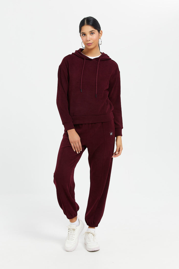 Redtag-Burgundy-Waffle-Jogger-With-Patch-Category:Joggers,-Colour:Burgundy,-Deals:New-In,-Filter:Women's-Clothing,-H1:LWR,-H2:LAD,-H3:SPW,-H4:ATP,-LWRLADSPWATP,-New-In-Women,-Non-Sale,-ProductType:Joggers,-Season:W23B,-Section:Women,-W23B,-Women-Joggers-Women's-