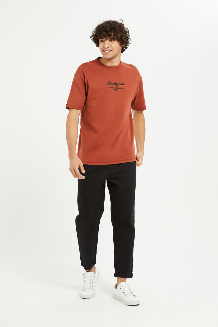 Redtag-Rust-Oversizes-Embroided-Sweat-Tee-Category:T-Shirts,-Colour:Orange,-Deals:New-In,-Filter:Men's-Clothing,-H1:MWR,-H2:GEN,-H3:TSH,-H4:TSH,-Men-T-Shirts,-MWRGENTSHTSH,-New-In-Men,-Non-Sale,-ProductType:Embellished-T-Shirts,-Season:W23A,-Section:Men,-W23A-Men's-