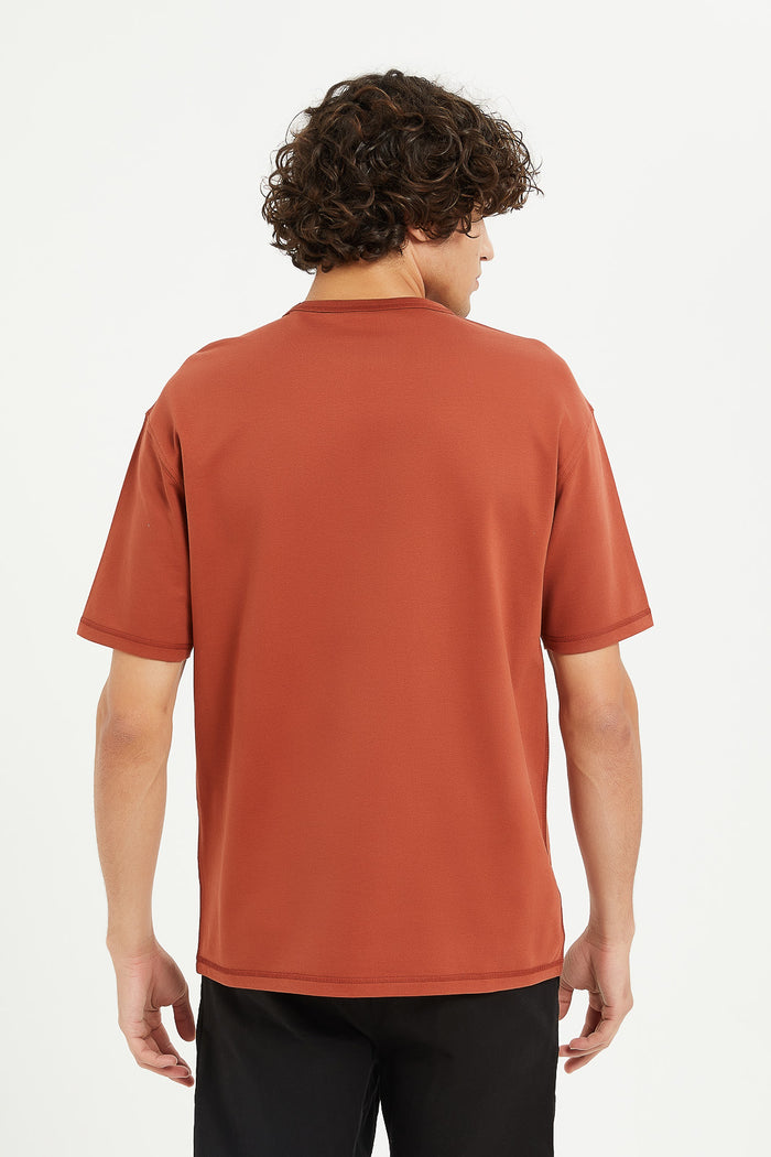 Redtag-Rust-Oversizes-Embroided-Sweat-Tee-Category:T-Shirts,-Colour:Orange,-Deals:New-In,-Filter:Men's-Clothing,-H1:MWR,-H2:GEN,-H3:TSH,-H4:TSH,-Men-T-Shirts,-MWRGENTSHTSH,-New-In-Men,-Non-Sale,-ProductType:Embellished-T-Shirts,-Season:W23A,-Section:Men,-W23A-Men's-