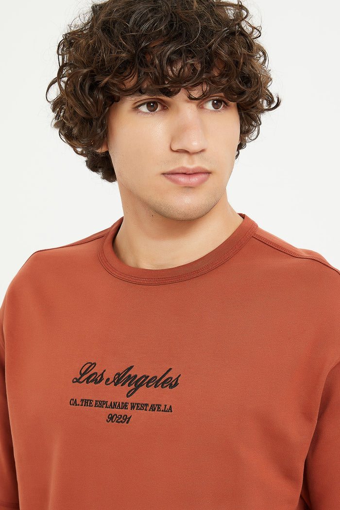 Redtag-Rust-Oversizes-Embroided-Sweat-Tee-Category:T-Shirts,-Colour:Orange,-Deals:New-In,-Filter:Men's-Clothing,-H1:MWR,-H2:GEN,-H3:TSH,-H4:TSH,-Men-T-Shirts,-MWRGENTSHTSH,-New-In-Men,-Non-Sale,-ProductType:Embellished-T-Shirts,-Season:W23A,-Section:Men,-W23A-Men's-