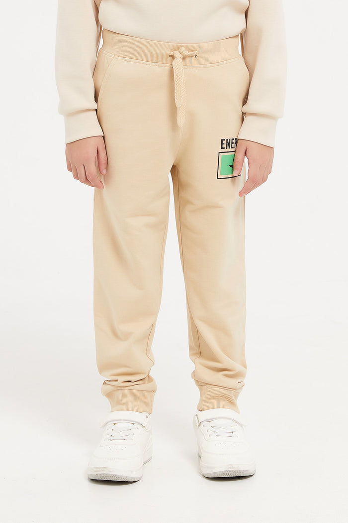 Redtag-Beige-Jogpant-With-Print-365,-BOY-Joggers,-Category:Joggers,-Colour:Beige,-Deals:New-In,-Filter:Boys-(2-to-8-Yrs),-H1:KWR,-H2:BOY,-H3:SPW,-H4:ATP,-KWRBOYSPWATP,-New-In-BOY,-Non-Sale,-ProductType:Active-Pants,-Season:365365,-Section:Boys-(0-to-14Yrs),-TBL-Boys-2 to 8 Years