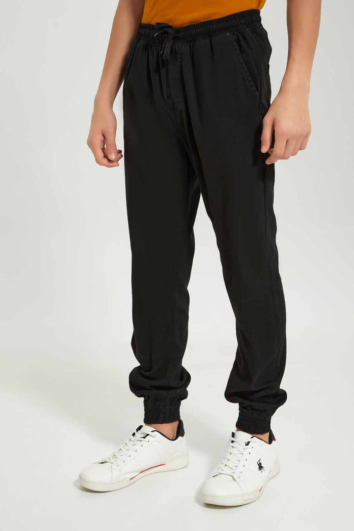 Redtag-Boys-Black-Pull-On-Jogger-BSR-Trousers,-BTS,-Category:Trousers,-Colour:Black,-Deals:New-In,-Dept:Boys,-Filter:Senior-Boys-(8-to-14-Yrs),-New-In-BSR-APL,-Non-Sale,-S23A,-Section:Boys-(0-to-14Yrs),-TBL-Senior-Boys-9 to 14 Years