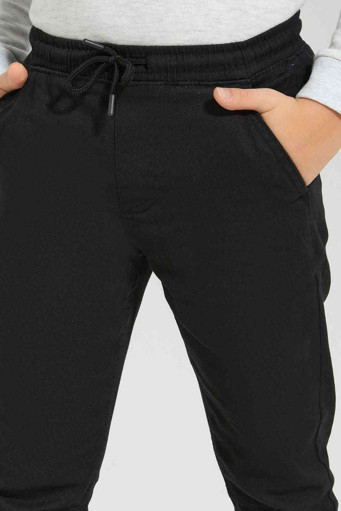 Redtag-Boys-Black-Elasticated-Waist-Jogger-BOY-Trousers,-BTS,-Category:Trousers,-Colour:Black,-Deals:New-In,-Dept:Boys,-Filter:Boys-(2-to-8-Yrs),-New-In-BOY-APL,-Non-Sale,-S23A,-Section:Boys-(0-to-14Yrs),-VLM-Boys-2 to 8 Years