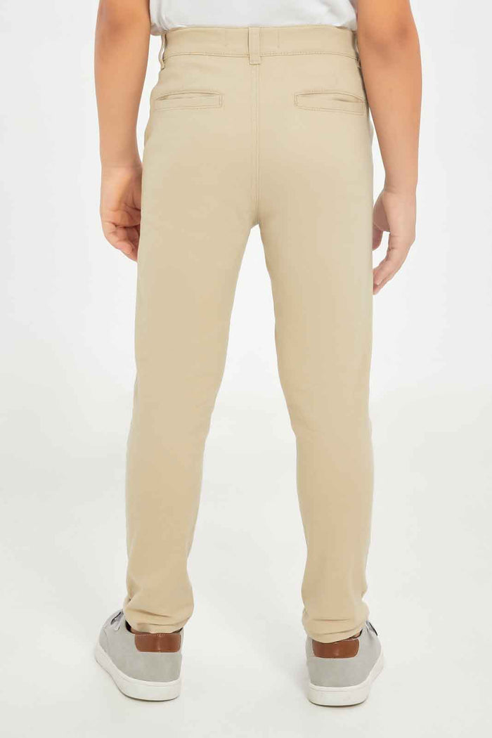 Redtag-Boys-Stone-Chino-Trouser-BOY-Trousers,-Category:Trousers,-Colour:Beige,-Deals:New-In,-Dept:Boys,-Filter:Boys-(2-to-8-Yrs),-New-In-BOY-APL,-Non-Sale,-S23B,-Section:Boys-(0-to-14Yrs),-VLM-Boys-2 to 8 Years