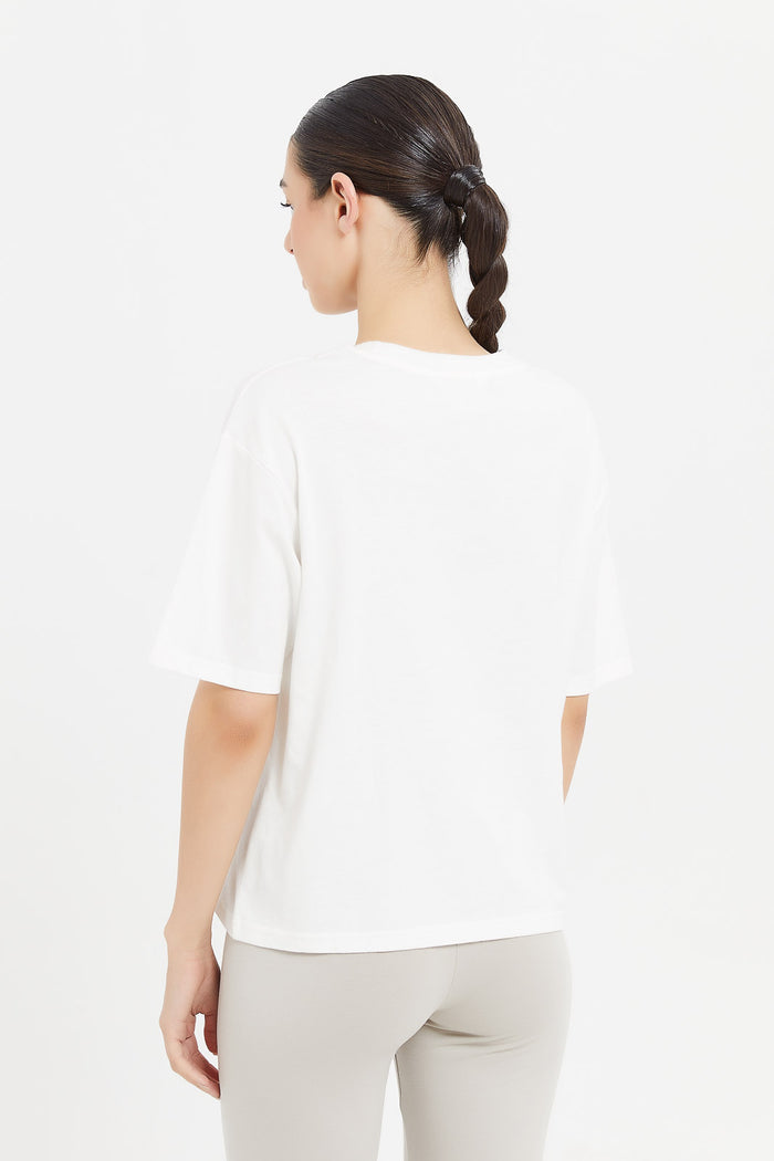 Redtag-Women-White-Boxy-Fit-Placement-Print-T-Shirt-Category:T-Shirts,-Colour:White,-Deals:New-In,-Filter:Women's-Clothing,-H1:LWR,-H2:LAD,-H3:SPW,-H4:ATS,-LWRLADSPWATS,-New-In-Women-APL,-Non-Sale,-ProductType:Graphic-T-Shirts,-S23D,-Season:S23D,-Section:Women,-Women-T-Shirts-Women's-